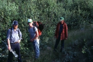 Mike Nelson (left), wildlife technicians John Scott and Eric Gese (extreme right) prepare to radio track deer and wolves.