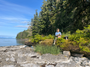 Kayla and Barley take a break and check the GPS during a survey on north